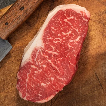 A top view of marbled New York strip steak