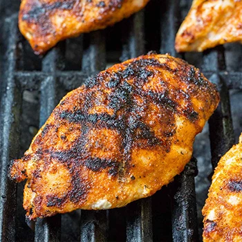 Close up shot of chicken breasts being grilled