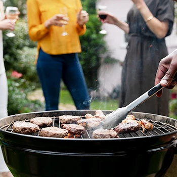 A person cooks for a BBQ party and calculates how much meat there is per person