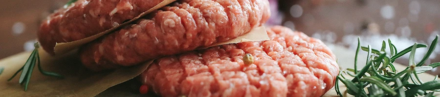 A close up shot of fresh burger patties