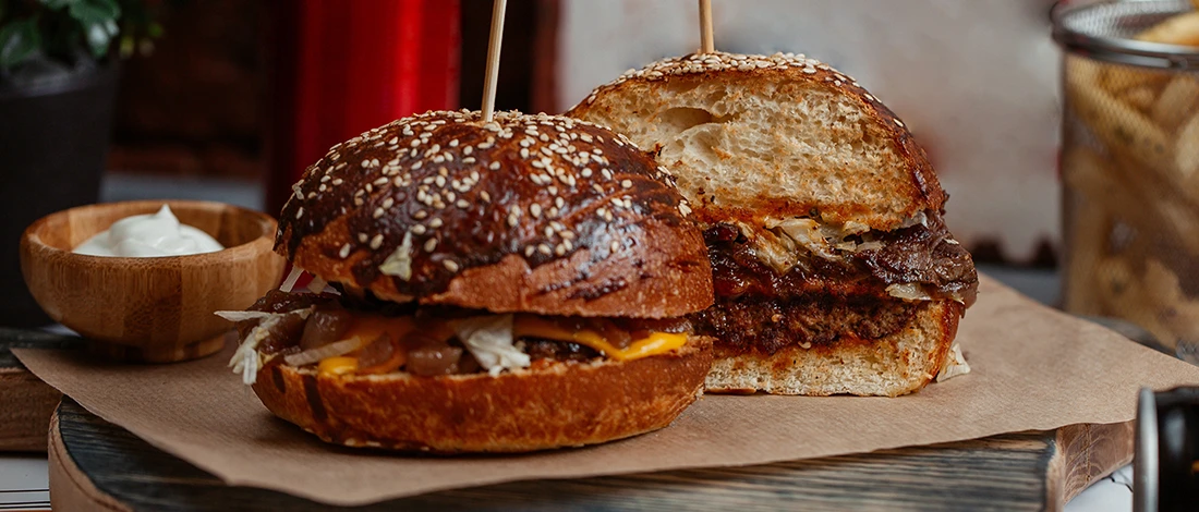 A medium-rare burger sliced into half