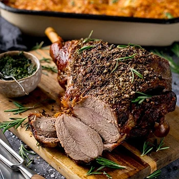 A delicious lamb roast on a wooden board