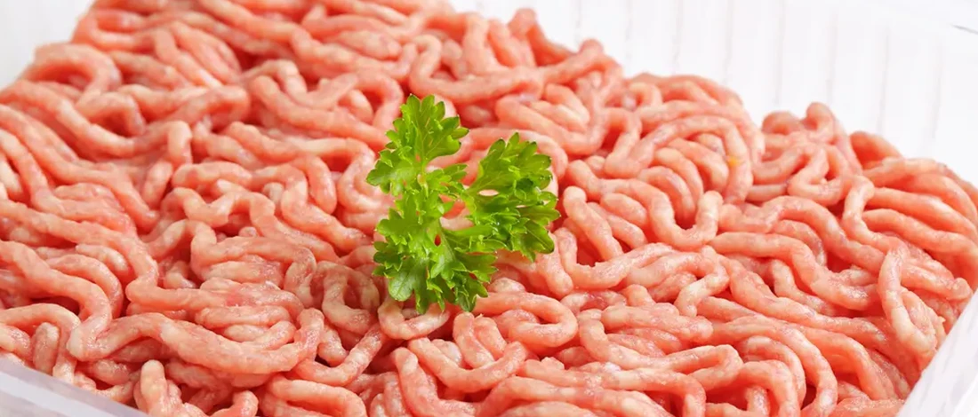 Raw minced meat with garnish on top