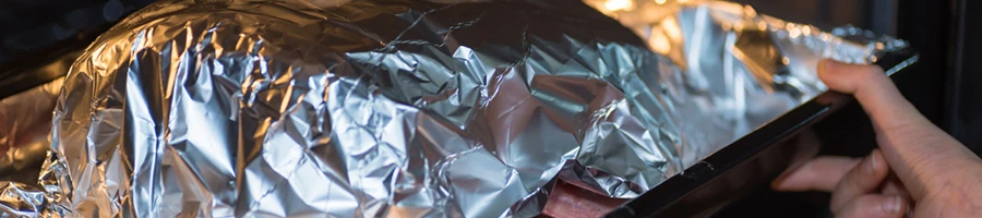A smoking meat without a smoker using wrapped foil inside an oven