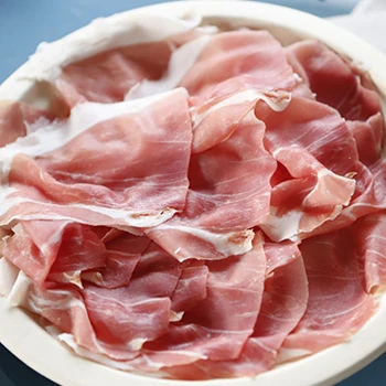 Prosciutto crudo on a white plate