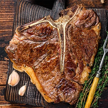 A top view of perfectly cooked porterhouse steak