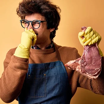 A man covers his nose as it tells him about the bad smell of pork meat