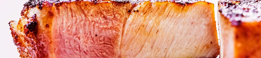 A close up shot of medium rare pork meat