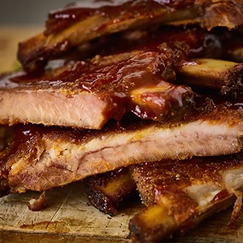 Close up shot of delicious spare ribs and baby back ribs