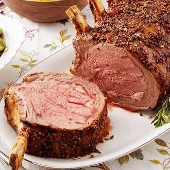 A bone-in prime rib roast on a white plate