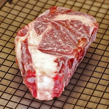 A close up shot of a frozen steak