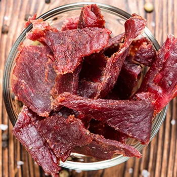 A top view of homemade beef jerky in a jar and how long it does