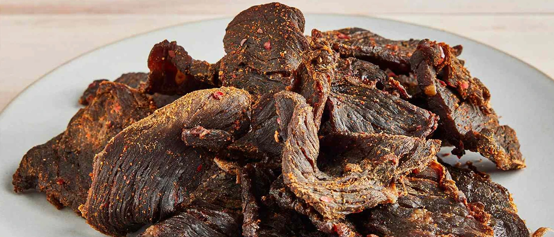 Beef jerky on a white plate