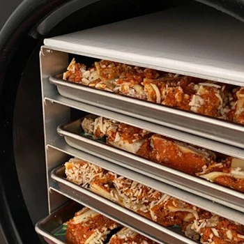 Trays with meat inside a freeze-dry machine