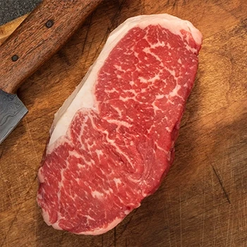 A top view of New York strip steak and sirloin cuts