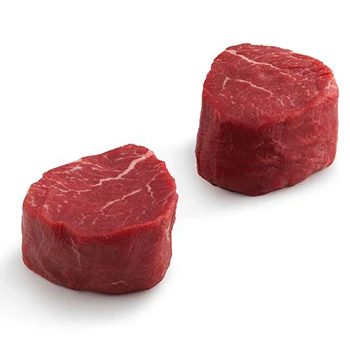 Two pieces of filet mignon on a white background