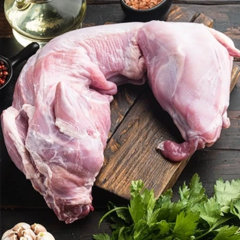 A raw rabbit meat on a wooden board