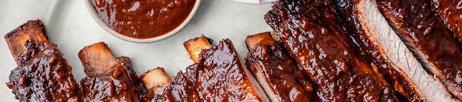 A top view of perfectly cooked smoked baby back ribs