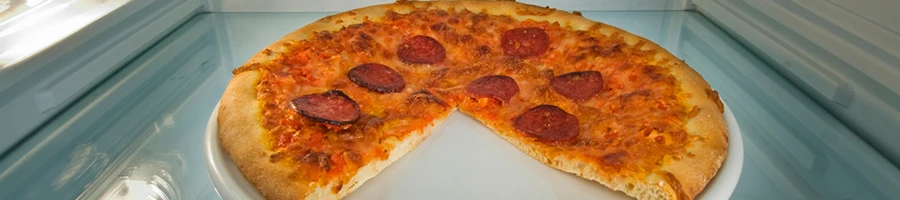 A leftover pizza stored inside the fridge