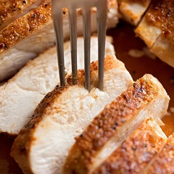 A close up shot of sliced chicken breast