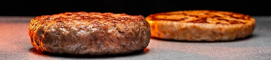A close up shot of perfectly shaped hamburger patties