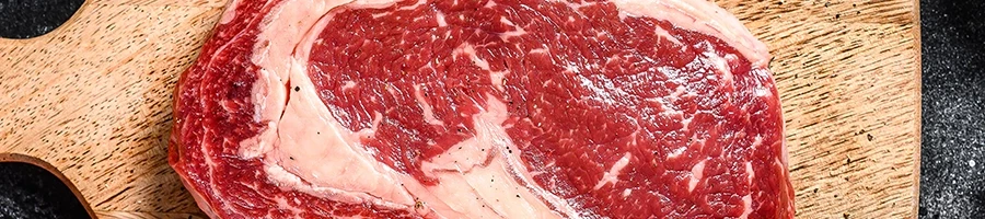 A top view of raw ribeye steak