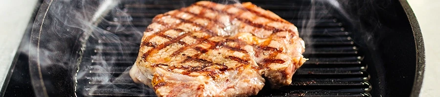 Cooking a steak on a griddle pan