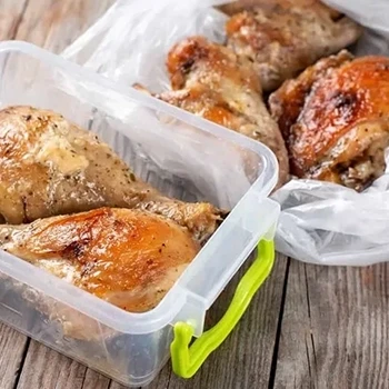 Leftover cooked turkey placed in a food container ready to be stored in the fridge