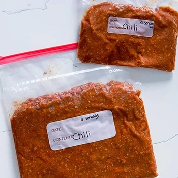 A top view of chili in a freezer-safe plastic bags