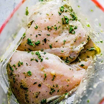 Marinating the chicken breasts with different herbs and spices