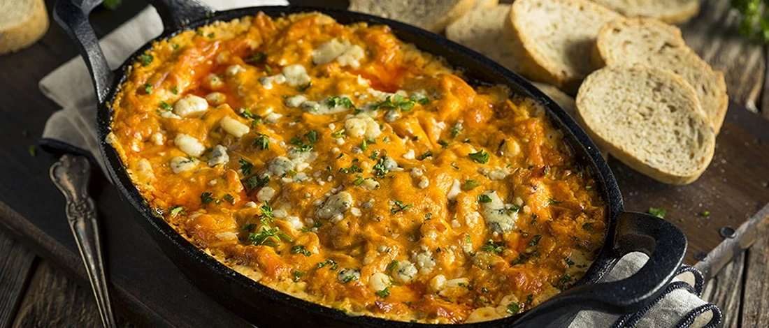 Smoked buffalo chicken dip with bread on the side