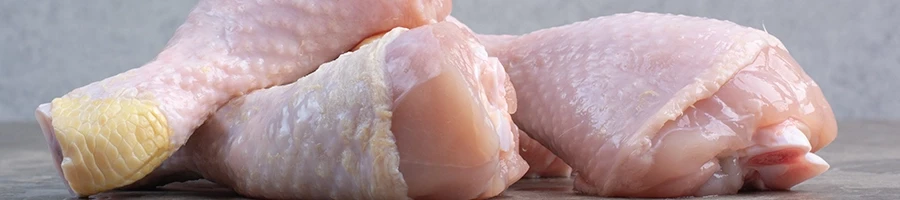 A close up shot of raw chicken legs
