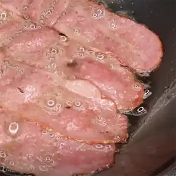 a photo of turkey bacon in a pan