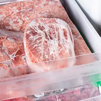 a picture of a frozen ham in refrigerator