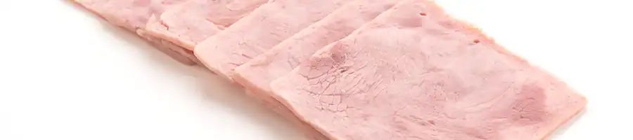 a pile of thawing frozen ham