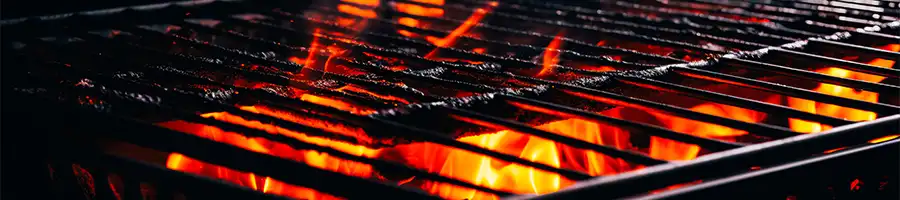 a photo of a burning charcoal grill that is getting hotter