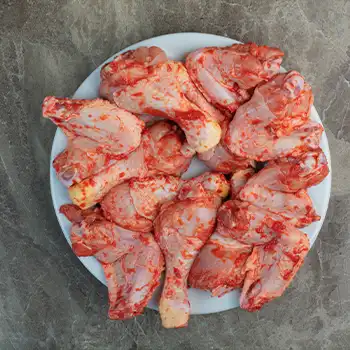 Barbecuing Frozen Chicken on a white plate