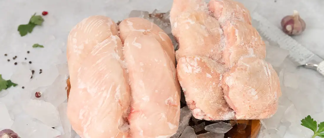 raw frozen chicken on top of crushed ice