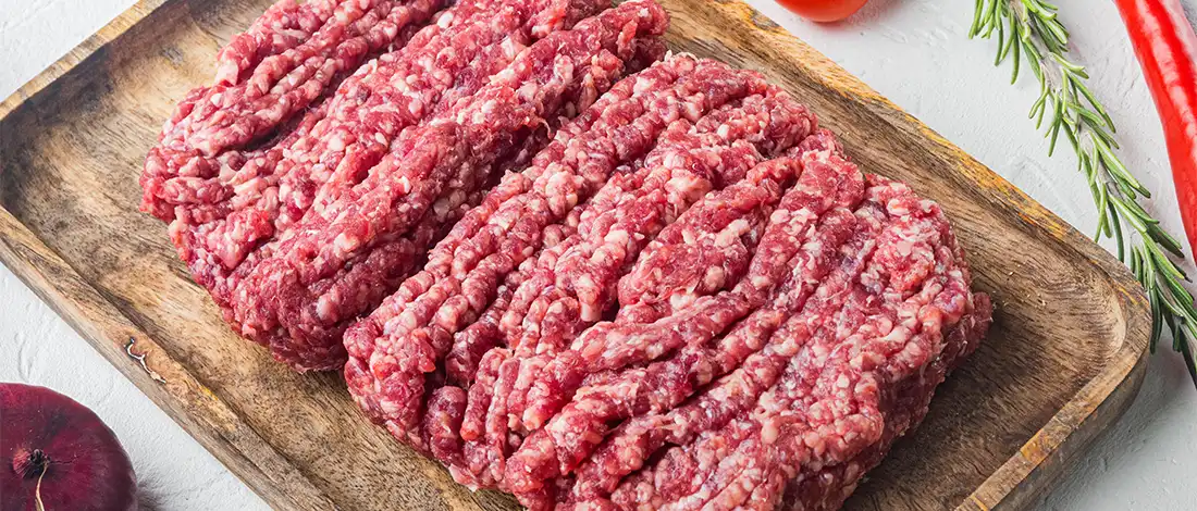 ground beef in a wooden plate