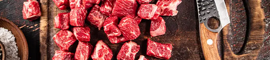 an image of beef chunks on a chopping board