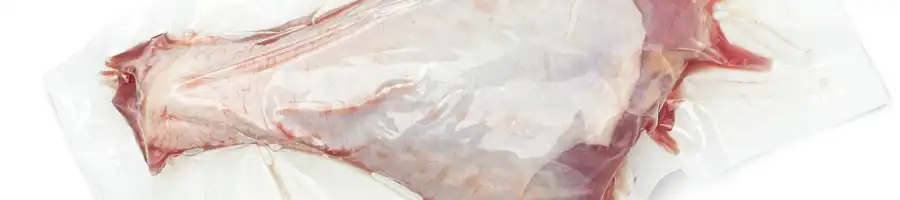 chicken leg sealed inside a plastic