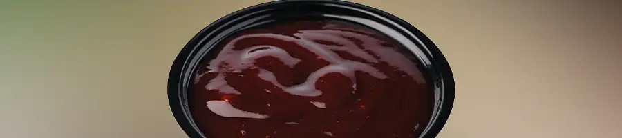 bbq sauce in a black bowl