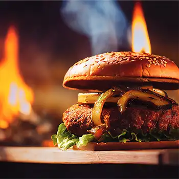 A hamburger with a fire background