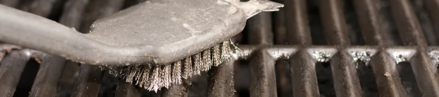 Brush cleaning a grill