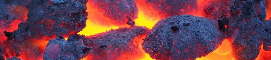 Charcoal being lit on a grill