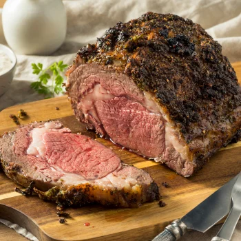 a crusted beef tenderloin being sliced