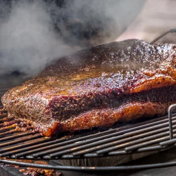 Steak smoking on the grill