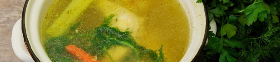 A close up shot of turkey stock on a bowl