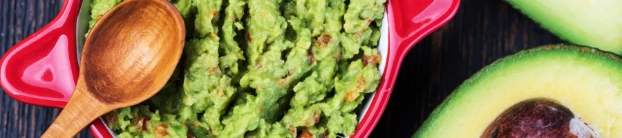 A top view of a guacamole side dish