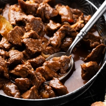 A close up shot of adobo steak in a bowl